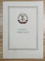 DDR Urkunde Bestenschleife in Silber, Ministerium des Innern mit Stempel, 1964