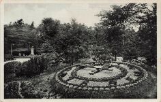 AK Komotau Chomutov Blumenuhr Park Böhmen 1933 gelaufen Postkarte