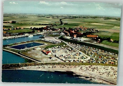 Bensersiel Fliegeraufnahme des Ortes mit Hafen Schwimmbad und Campingplatz