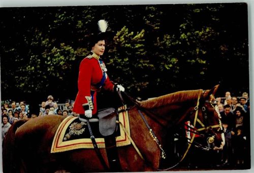 The Queen riding along the spectator-lined route