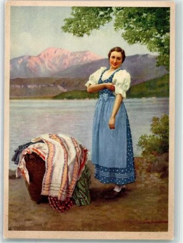 Wien Eine Frau in Tracht mit einem Korb voll bunter Decken