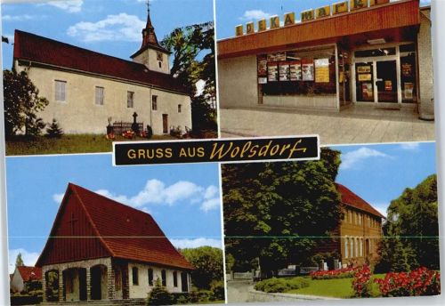 Wolsdorf Kirche Kreuz Haus Baum Blumen