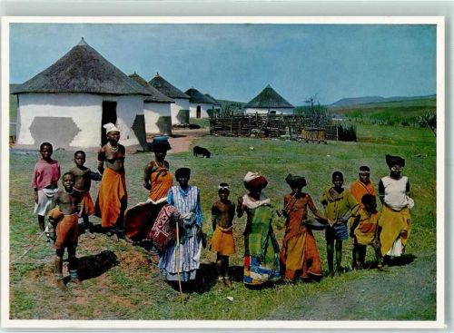 A Happy Group of Xhosa People in their traditional Red Blankets and Pipe Smoking Women