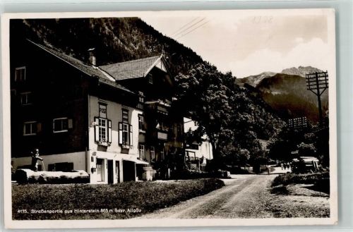 Hinterstein Post Briefkasten Brunnen Strommasten Holzstapel Gasthausstempel