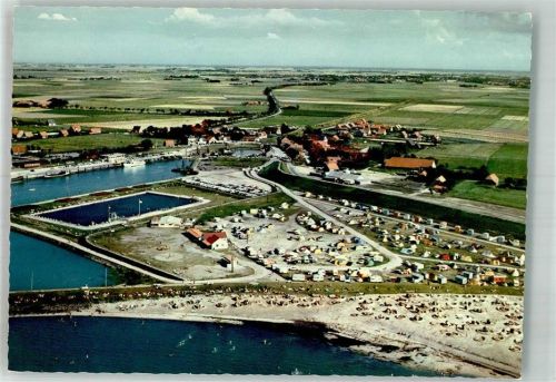 Bensersiel Fliegeraufnahme des Ortes mit Hafen Schwimmbad und Campingplatz