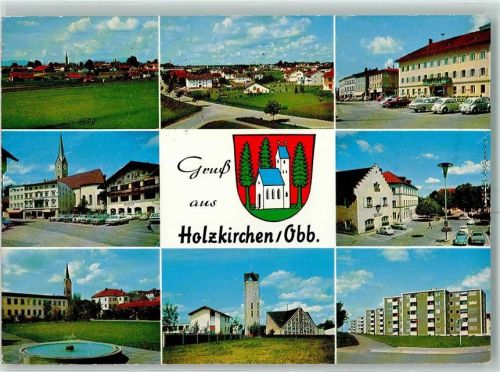 Holzkirchen VW Käfer Hausbemalung Oldtimer VW Käfer Maibaum Springbrunnen Hochhaus Wappen