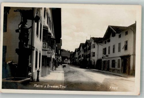 6143 Matrei am Brenner Foto AK Denkmal Brunnen Straßenansicht