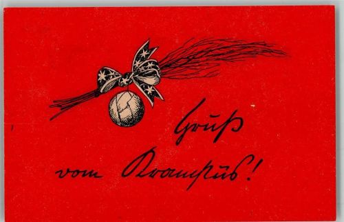 Ein Reisigbesen mit einer Schleife und einer Weihnachtskugel Krampus