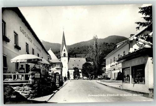 Kötschach mit Gasthof zur Sonne Kaufhaus Moser und Pfarrkirche Unsere Liebe Frau