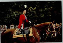 The Queen riding along the spectator-lined route Adel England