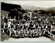 36304 W6323 Hopfgarten , Hess Foto AK Trachtengruppe Kapelle