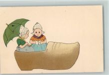Hollendkinder sitzen in einem großen Holzschuh ca 1910 AK Holzschuh Künstlerkarte