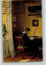 Frau sitzt am Sekretär AK Buch lesen
