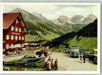 6992 Mittelberg , Kleinwalsertal Foto AK Omnibus Auto Gasthaus Alte Krone