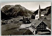 6992 Mittelberg , Kleinwalsertal Foto AK Kirche Pension Gasthaus Alte Krone