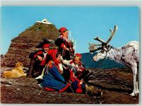 Lapps with a reindeer at the turf-hut Trachten Norwegen
