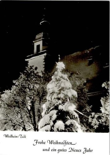 Weilheim Weihnachtsbaum vor der nächtlichen Peterskirche Weihnachts- und Neujahrsgrüße
