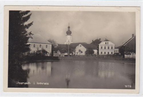 Fotokarte von Utzenaich im Innkreis. Teilansicht. Am 04.02.1941 als Feldpost gelaufen. Leichter Bug oben links, kleiner Knick oben links und rechs, leicht fleckig, sonst gut erhalten. PLZ 4972.<br />