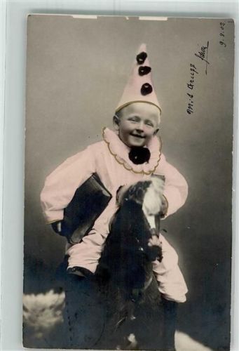 1902 Kind als Harlekin verkleidet auf einem Schaukelpferd