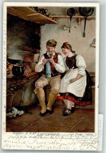 1899 Frau im Trachtenkleid gibt dem Mann Strickunterricht