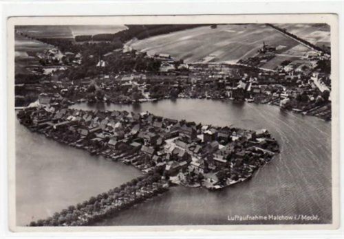 Malchow i. / Meckl. mit Luftaufnahme. Postalisch gelaufen mit Poststempel 1931. Rückseite leicht stockfleckig, sonst gut erhalten.