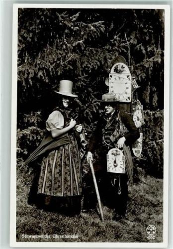 1934 Uhrenhändler und Frau in Tracht auf AK