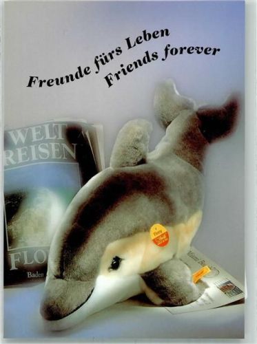 Delfin Stofftier mit dem Knopf im Ohr