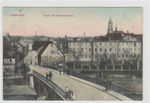 Roßwein mit Brücke und Dresdenerstrasse gelaufen von 1914. Ecken mit Albumabdrücken, leichter Stempeldurchdruck, leicht fleckig, sonst gut erhalten.