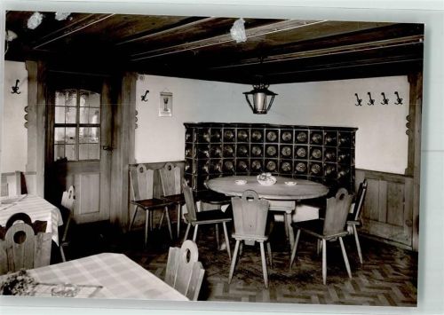 Burgberg Hotel Löwen Gaststube mit Kachelofen Foto Orginal aus Archiv eines Ansichtskartenverlags Ort handschriftlich