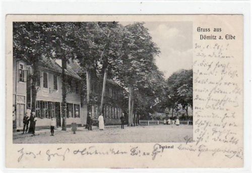 Gruß aus Dömitz a.d. Elbe mit Partie am Denkmal gelaufen von 1903. Ecken mit Albumabdrücken, sonst gut erhalten.