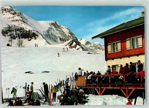 Mallnitz Winter Gasthaus Häusler Alm gegen die Tauern Skifahrer