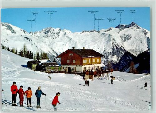 Mallnitz Winter Gasthaus Häusler Alm gegen die Tauern Skifahrer
