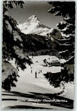 6632 Ehrwald Foto AK Gasthof Alpenglühn Gasthaus Ehrwalder Alm 1550 m Sonnenspitze Winter Schnee