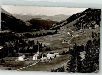 87538 W8975 Balderschwang Foto AK mit Kirche St. Anton und der Säntisgruppe