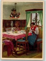 Junge Frau in bunter Tracht bei der Näharbeit in der Stube Indanthren 1930 Künstlerkarte