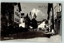 6370 Kitzbühel Foto AK Kirche Turm Auto Geschäfte Mädchen Männer