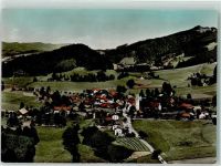 88167 W8999 Grünenbach , Allgäu Foto AK Fliegeraufnahme des Ortes mit Kirche St. Ottmar