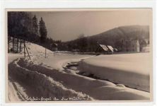 Holzhau mit Partie an der Mühle im Winter gelaufen, Marke entfernt, handschriftliches Datum von 1942 kleiner Knick unten links, sonst gut erhalten.