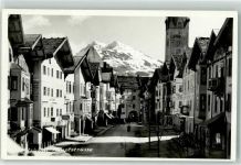 6370 Kitzbühel Foto AK Hauptstraße Tor Kirche Geschäfte