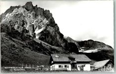 Mitterfeldalm Foto AK Berghütte mit Manndlwand Hüttenstempel