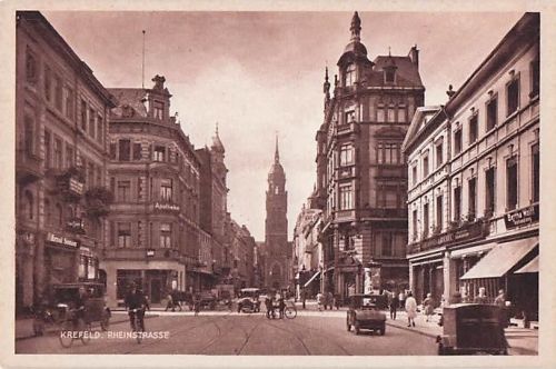 AK Krefeld, Rheinstrasse mit Geschäften und Kirche