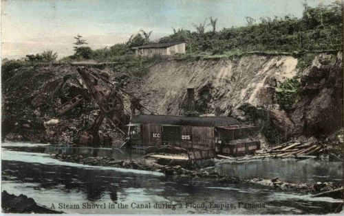A steam Shovel in the Canal during a Flood - Panama