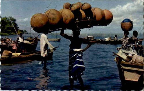 Girl carrying gourds