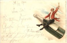 Mann auf Sektflasche