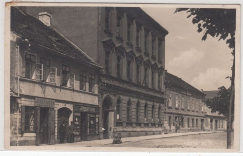 Tschechien/Böhmen - Kostelec n.L., Straßen-/Gebäudeansicht sw-Fotokarte 1931