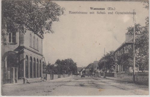Elsass - Wanzenau (KOS) Hauptstraße, Schul- und Gemeindehaus sw-AK gelaufen 1915