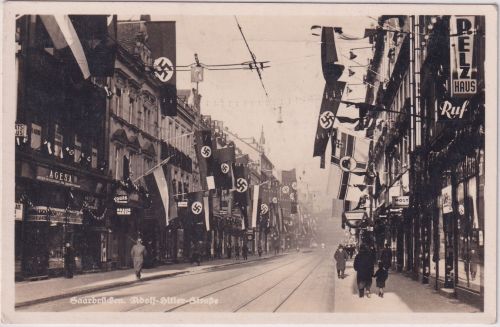 Saarland - Saarbrücken AH-Straße mit "Fest"-Beflaggung sw-Foto-AK gelaufen 1935