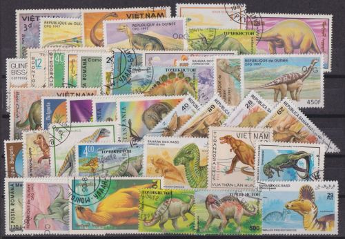 Dinosaurier inter. Lot von 43 verschied. Marken + 1 Block Prähistorische Tiere