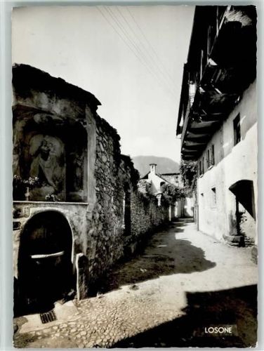 6616 Losone - Brunnen mit Heiligenbold