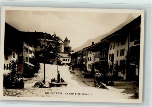 1663 Gruyères - La rue et le Crucifix
